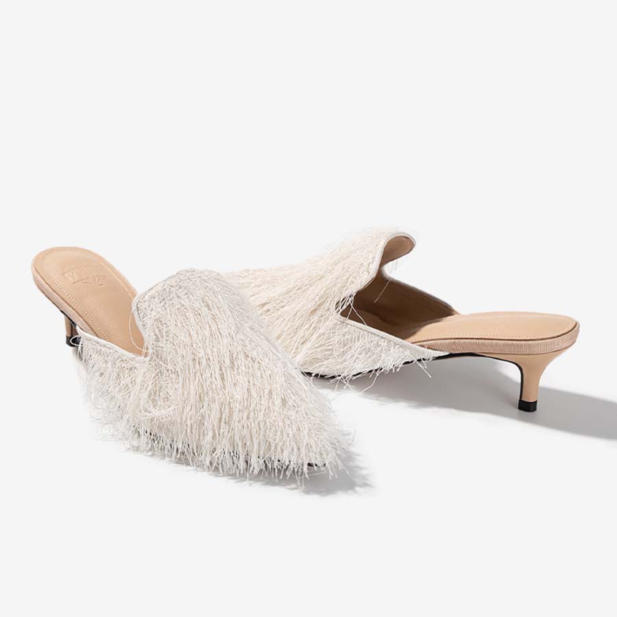 Silken Tassel – Ivory Fringe Mules with Eastern Flair